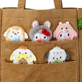 Carry the charm of the forest close with this adorable Sanrio Woodland Creature Handbag, crafted from soft brown corduroy fabric. This delightful accessory brings together cozy textures and whimsical design, perfect for adding a touch of nature-inspired style to your everyday look. Featuring CInnamoroll, Hello Kitty, My Melody, Pompompurin, and Pochacco in a playful woodland creature motif, the handbag showcases beloved Sanrio characters, each with its own unique personality.